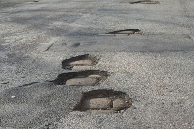 Potholes in the road